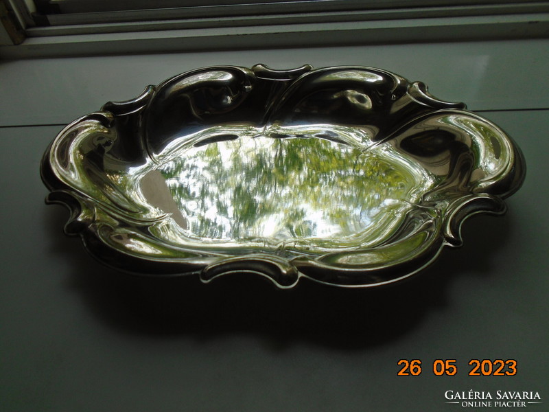 Spectacular mirror-bright silver-plated oval marked baroque serving bowl with wavy rim