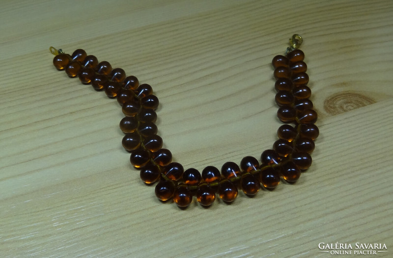 Bracelet made of topaz drop-shaped 9 x 6 mm glass beads, attractive on the hand.