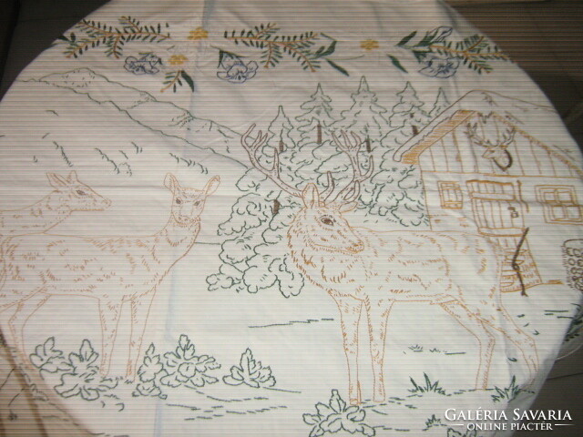 A dreamy hand-embroidered forest scene wall hanging