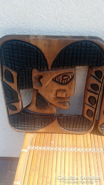 Carved 2 African head wall pictures. Negotiable
