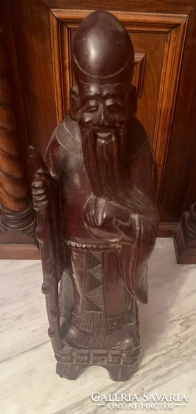 Eastern wise wooden statue
