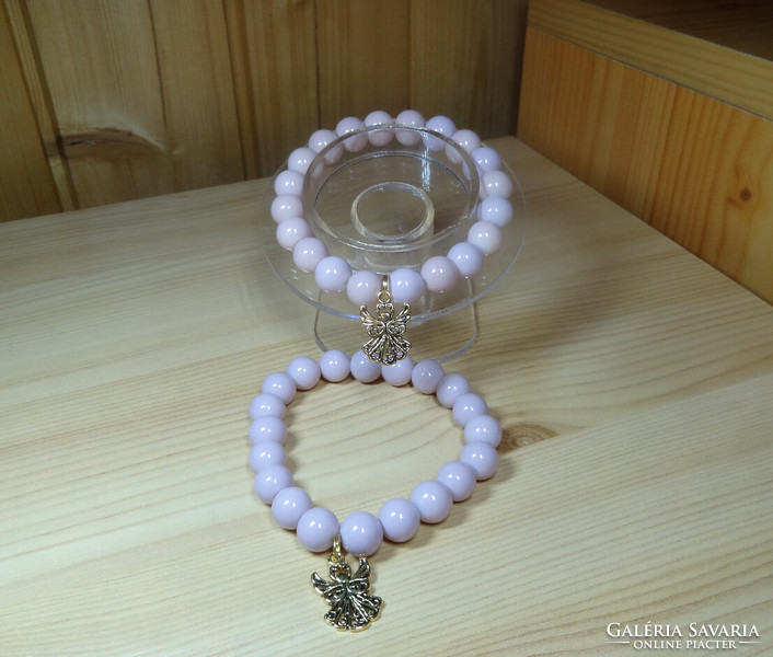 A bracelet made of beautiful, shiny powder-colored glass beads with solid decoration