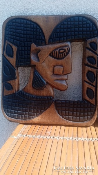 Carved 2 African head wall pictures. Negotiable