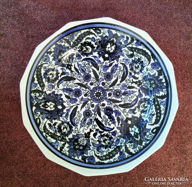 Hand-painted porcelain decorative plate with a blue pattern