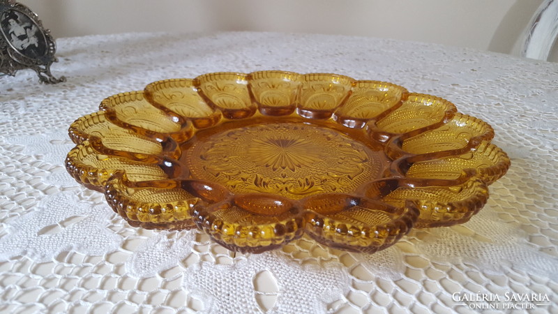 Beautiful amber-colored glass egg holder, offering