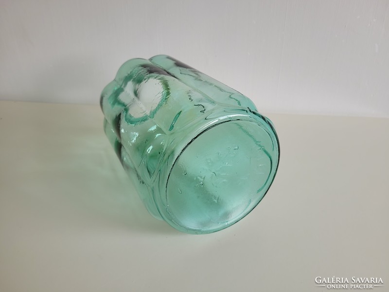 Old ribbed big mason jar with green shaggy glass vintage decoration