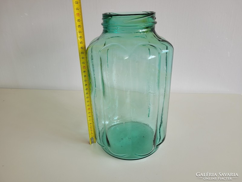 Old ribbed big mason jar with green shaggy glass vintage decoration