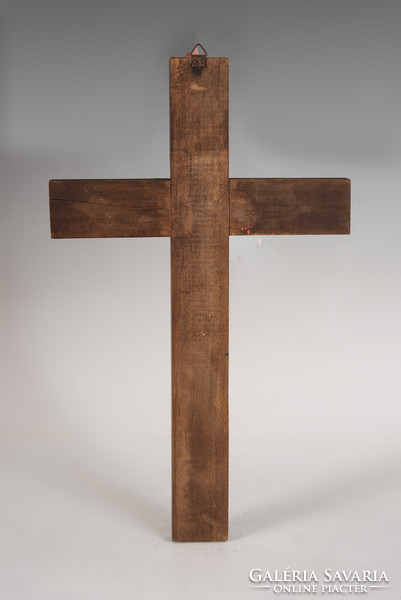 Silver crucifix on wooden cross