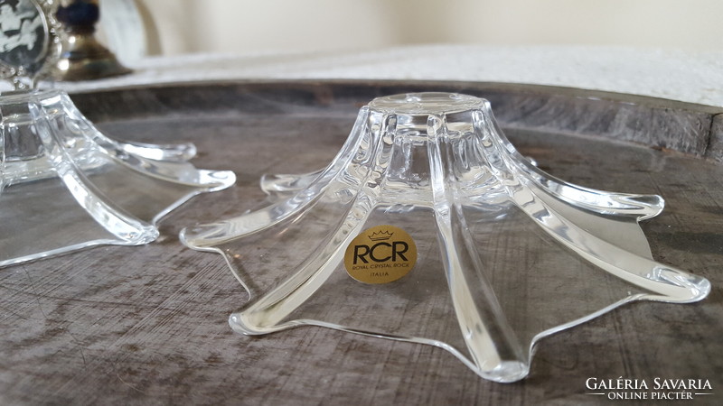 A pair of rcr crystal candle holders with a special shape