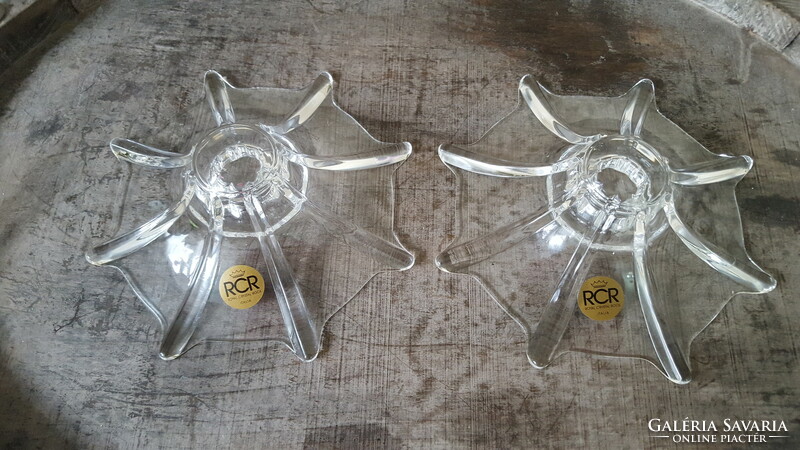 A pair of rcr crystal candle holders with a special shape