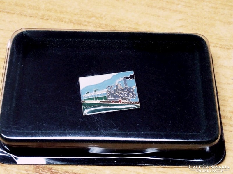 Steam express train fire enamel pin from the 1980s, in original packaging