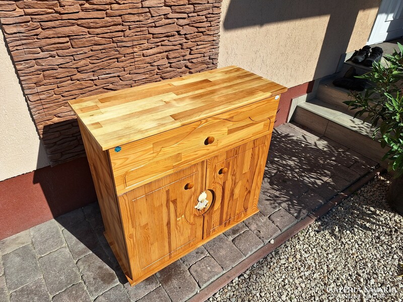 For sale: a Drewex pine children's chest of drawers with shelves and drawers, in good condition, completely made of pine.