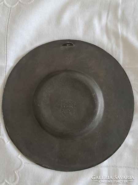 Embossed pewter plate with a religious scene
