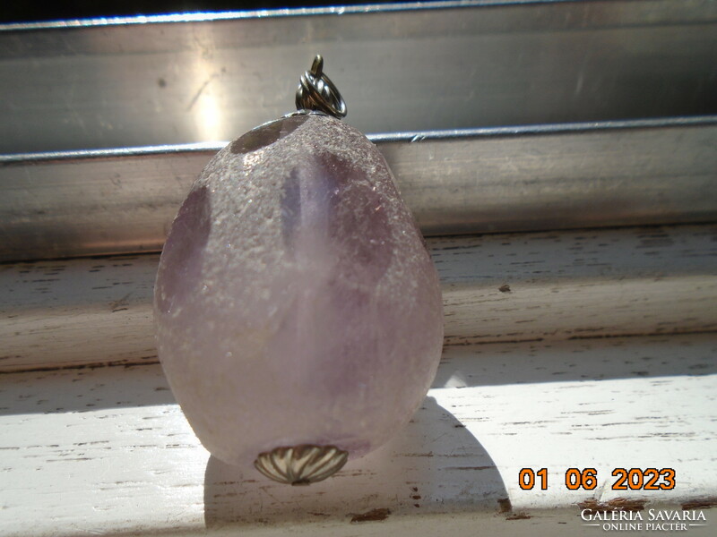 Large natural purple rose quartz (?) with interesting faceted 