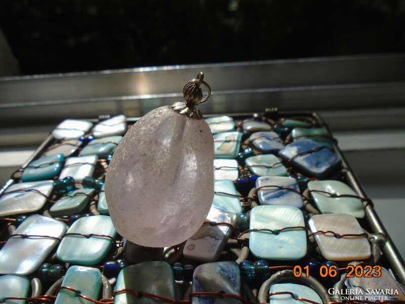 Large natural purple rose quartz (?) with interesting faceted 