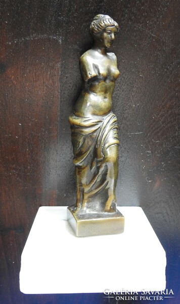 Bronze nude on a marble slab