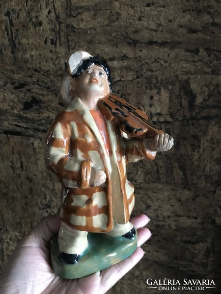 Old Szécs ceramic figure of a gypsy playing the violin is defective