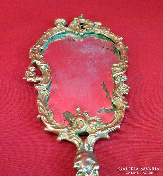 Antique copper hand mirror. In a nice decorative frame.