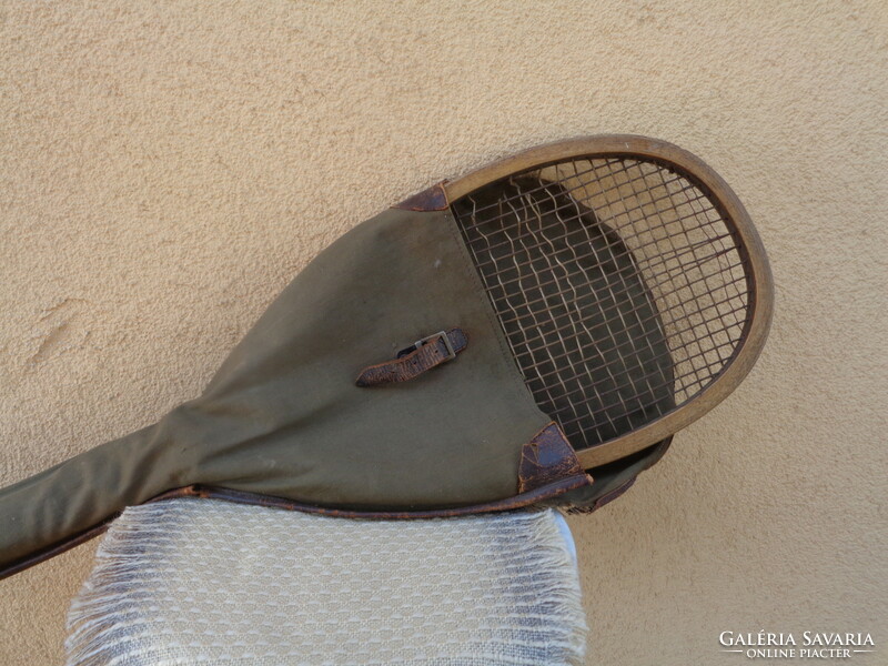 Antique tennis racket, with contemporary canvas case, marked old sports equipment from the 1910s