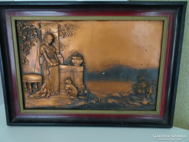 Bronze wall picture of a lady with her cat in a nice frame.