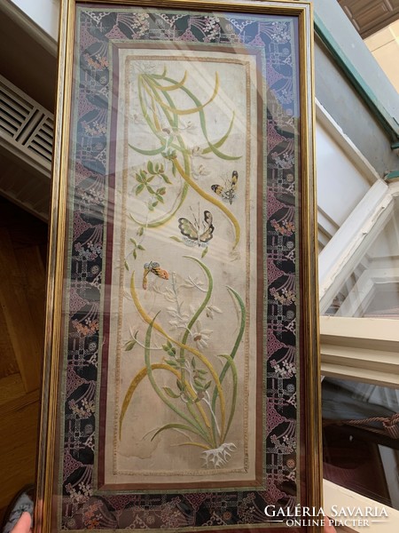 Embroidered caterpillar silk wall decoration in a frame