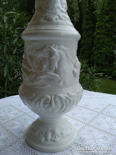 White capodimonte ceramic carafe decorated with giant puttos