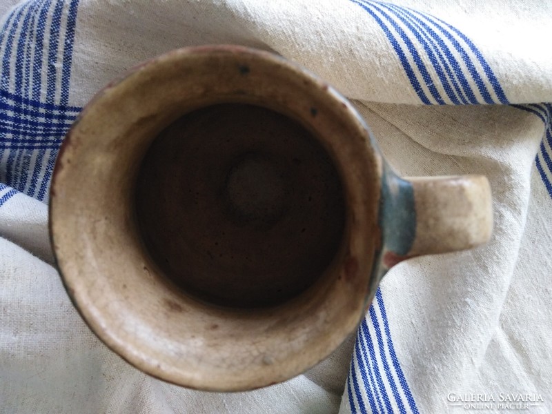 Antique earthenware jug - with a folk character