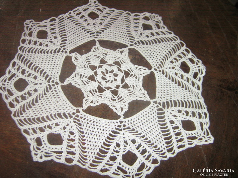 Beautiful snow-white antique hand-crocheted round octagonal tablecloth