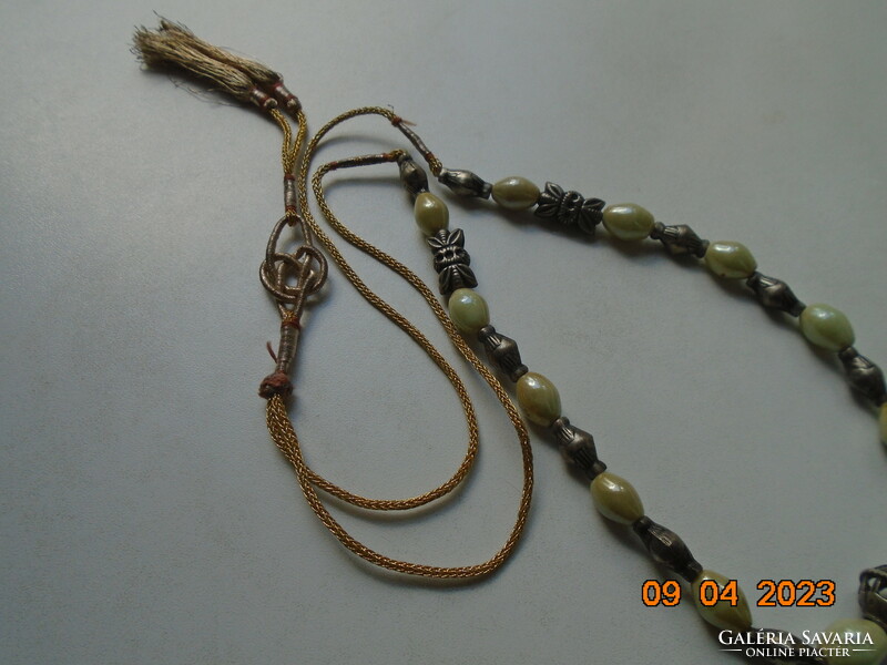 Interesting neck blue Celtic knot with gold thread cord, pale green opal glass and figurative silver beads