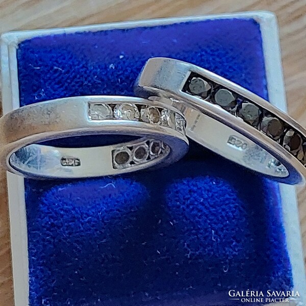 Silver wedding rings with black and white zircon stones