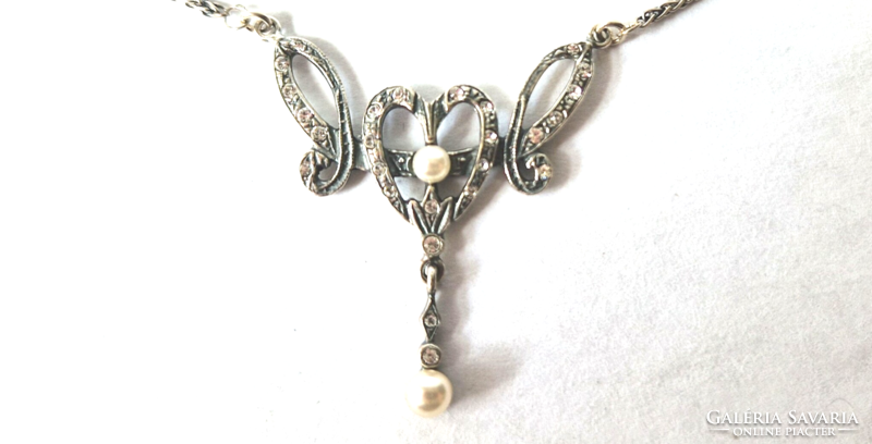 Necklace with a pearl in the shape of a heart pendant