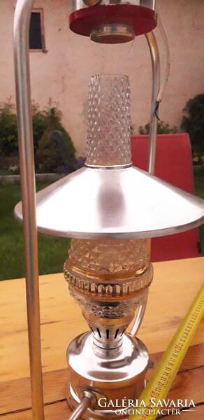 A retro electrometal hat lamp in the shape of a kerosene lamp in mint condition