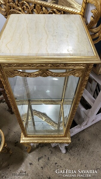 Gilded cube-shaped display case