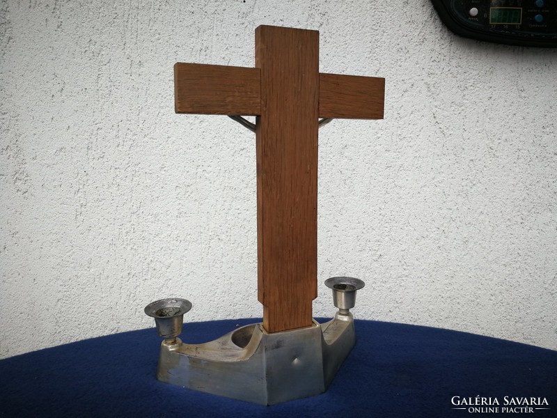 Candlestick with crucifix and holy water holder made of metal. Home altar, blessed Jesus Christ, corpus,