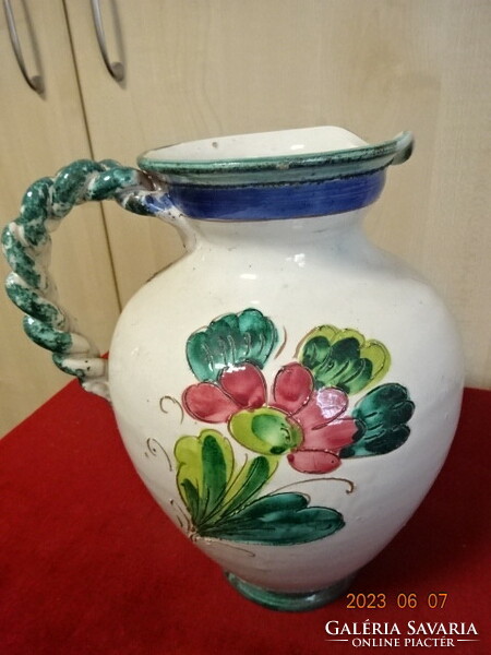 Hand-painted glazed ceramic jug with braided handle, height 26 cm. Jokai.