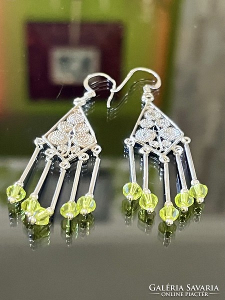 Unique pair of dangling silver earrings