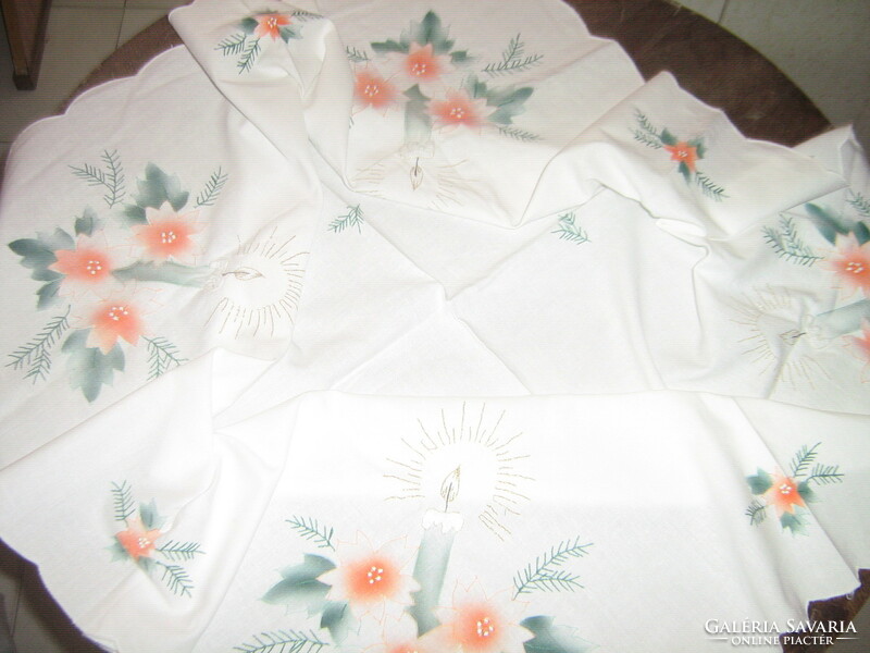 A beautiful white tablecloth with a Christmas pattern