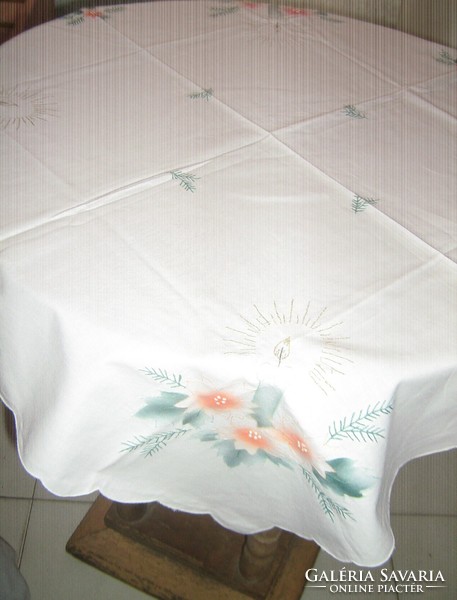 A beautiful white tablecloth with a Christmas pattern