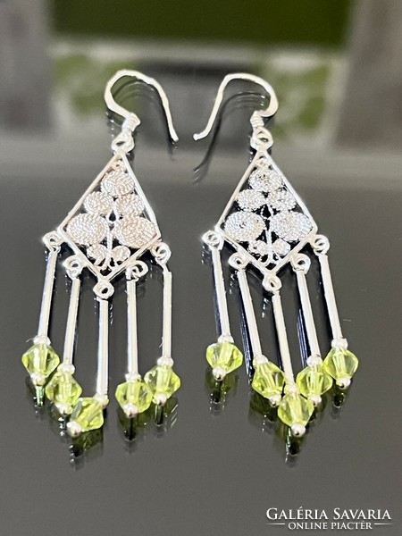 Unique pair of dangling silver earrings