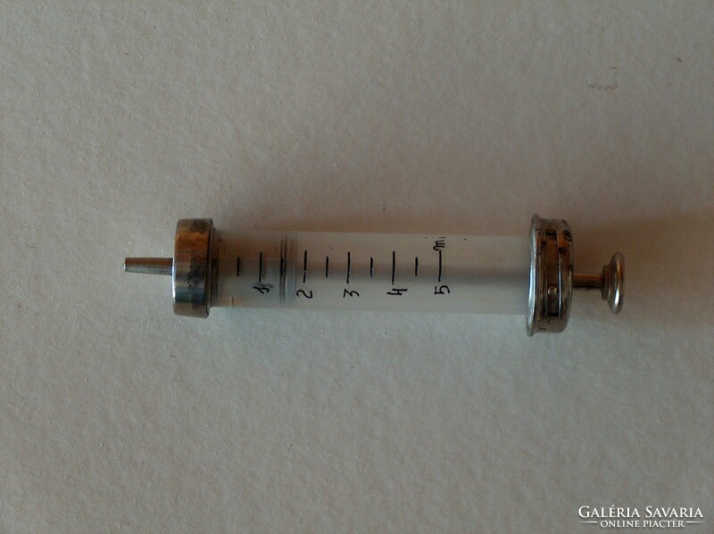 Old glass-metal syringe, used, good condition