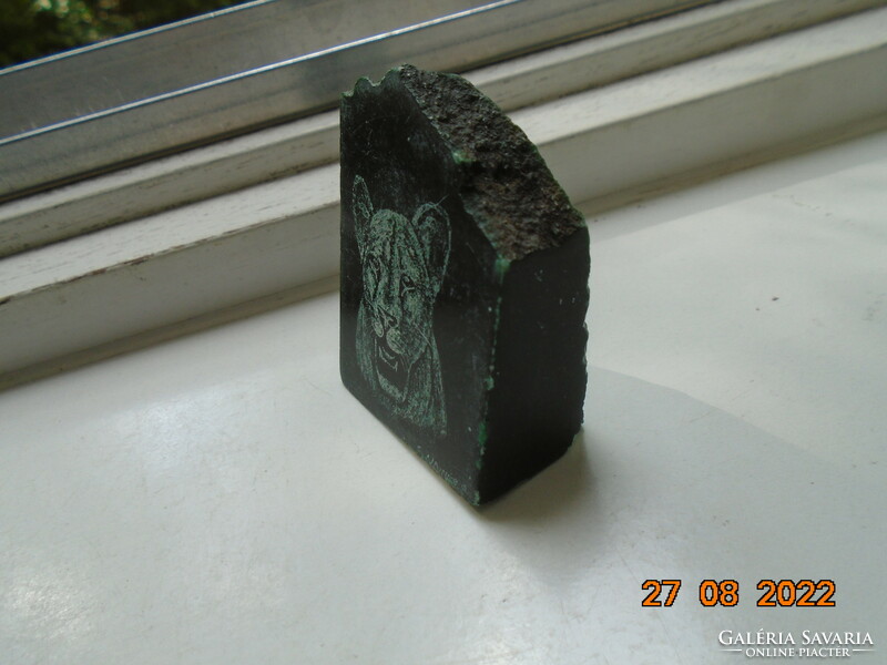 Polished stone with the signature image of a panther