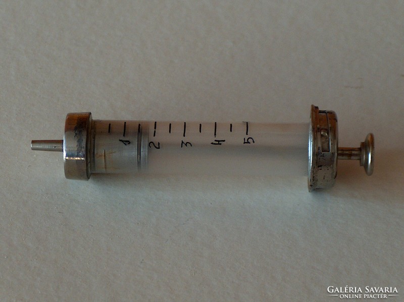 Old glass-metal syringe, used, good condition