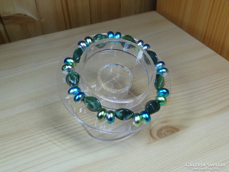 Bracelet made of multiple and beautiful colored flat glass beads and twisted beautiful acrylic beads.