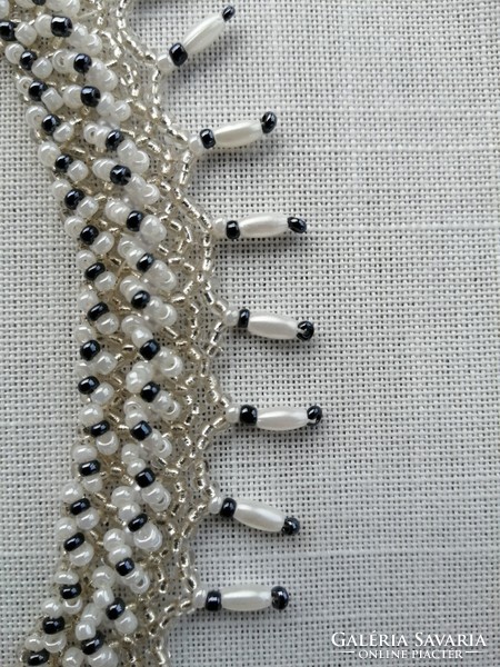 White, silver-centered transparent pearl necklace