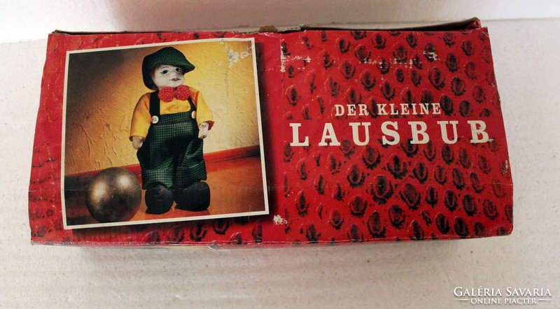 Der kleine lausbub is an old German decorative doll