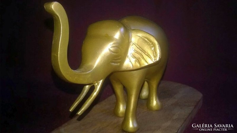 Metal elephant on a wooden base - shelf decoration