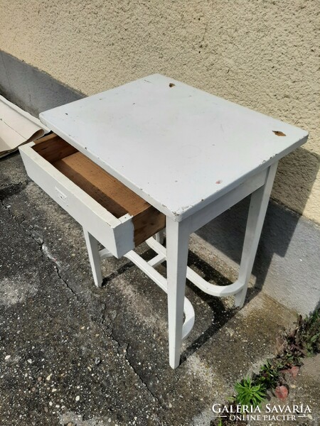 A very charming antique small table with a nice lock cover and stylish legs