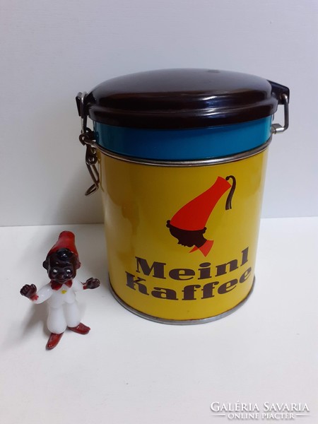 Nice condition julus meinl coffee plate box with a vinyl lid and a small nutmeg figure