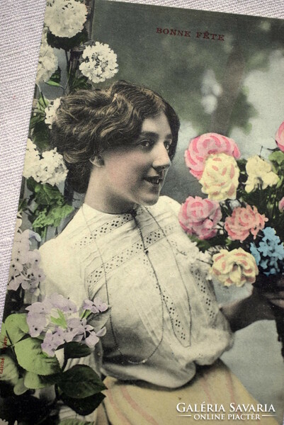 Antique greeting colored photo postcard with lady flowers