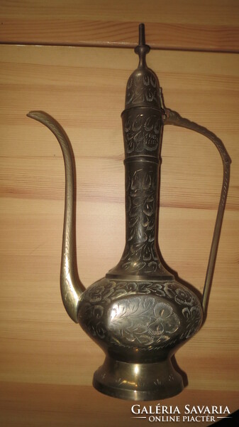 Copper teapot with an oriental motif